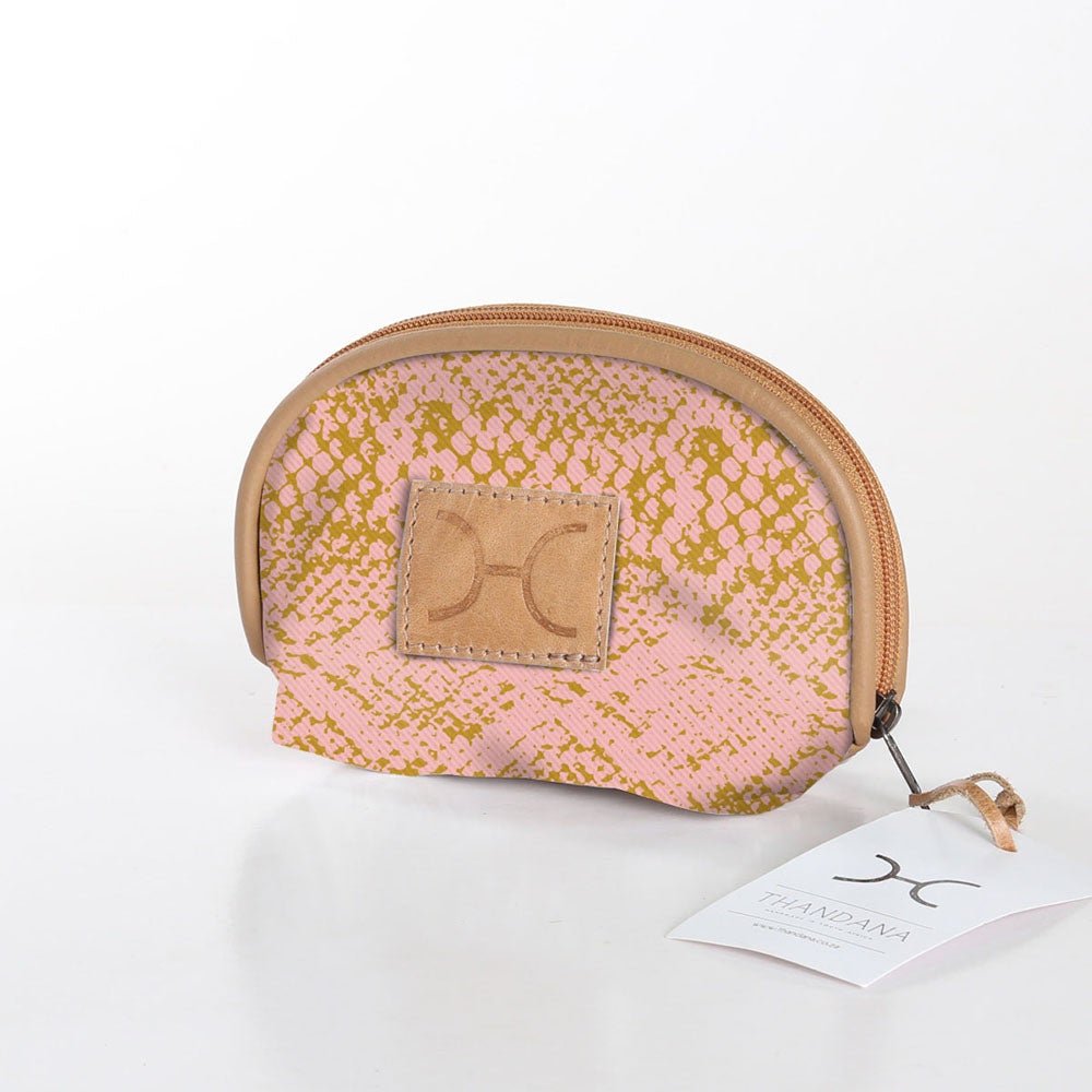 Compact and travel-friendly Thandana Makeup Bag in a stylish patterned design with secure Chunky Zip