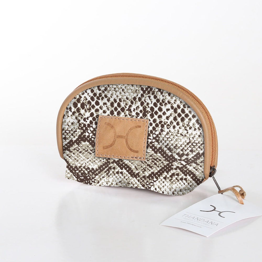 Compact and travel-friendly Thandana Makeup Bag in a stylish patterned design with secure Chunky Zip